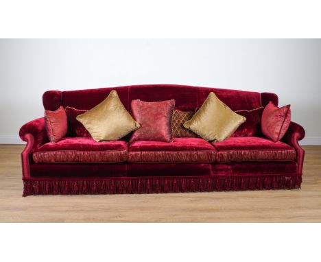 PROVASI: A LARGE RED VELVET AND PAISLEY SILK UPHOLSTERED WINGBACK SOFAOn turned gilt supports, 307cm wide; 105cm high