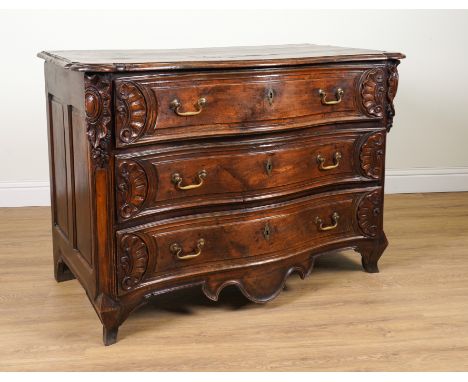 AN 18TH CENTURY ITALIAN PROVINCIAL CARVED WALNUT SERPENTINE THREE DRAWER COMMODE138cm wide; 67cm deep; 96cm high