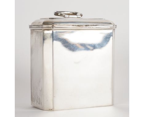 A SILVER TEA CADDYOf cut cornered rectangular form, with a hinged handle to the hinged lid, gilt within, by Mappin and Webb, 