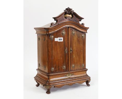A MINIATURE WALNUT TWO DOOR ARMOIREWith single drawer base, 31cm wide; 48cm highThere is some light worm to the backboards, a