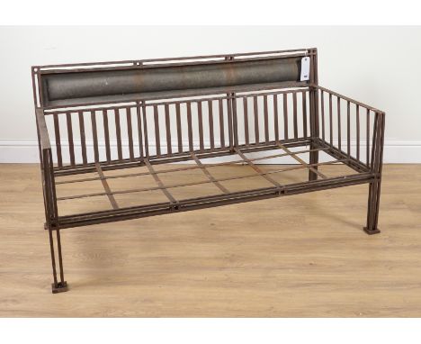 IN THE MANNER OF FRANK LLOYD WRIGHT: A BOX METAL FRAMED BENCHWith beaten brass convex panel back, 140cm wide; 75cm high