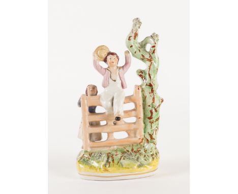 `HAPPY AS A KING' A RARE STAFFORDSHIRE POTTERY GROUPCirca 1870
After a painting by William Collins R.A, modelled as boy sitti
