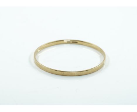 A 9CT GOLD CIRCULAR BANGLEUndecorated, internal diameter 7.7cm, Birmingham 1929, weight 24.7 gms