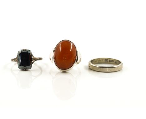 THREE RINGS (3)Comprising; a Swedish white gold wedding band ring, detailed 18 K, ring size R and a half, weight 4.7 gms, an 
