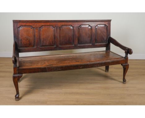 AN 18TH CENTURY AND LATER OAK OPEN ARM SETTLEWith five arch panel back, 182cm wide; 106cm high