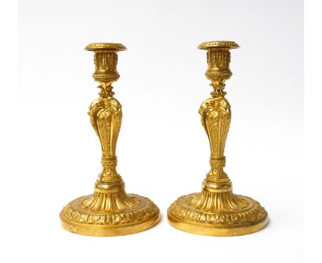 A PAIR OF LOUIS XVI STYLE ORMOLU CANDLESTICKS (2)19th Century 
Modelled with Bacchus masks issuing from acanthus clad baluste