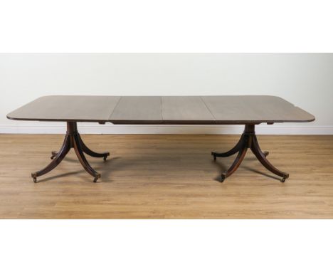 A GEORGE III STYLE MAHOGANY TWIN PILLAR D-END EXTENDING DINING TABLEWith two extra leaves, 120cm wide; 194cm long; 291cm long