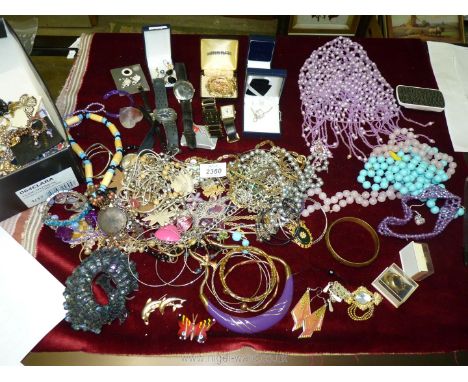 A large quantity of mixed Costume jewellery including Timex watch, necklaces, bangles, beaded skull cap etc