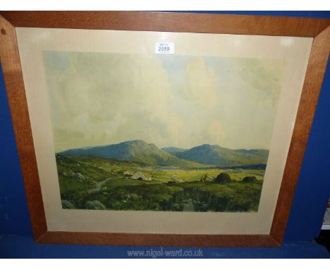 A wooden framed print of  'Sun Lit Valley - Donegal' by J.H Craig, 26'' x 22''.