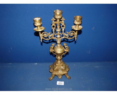 A brass three branch candelabra.