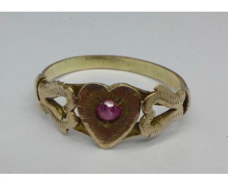 A yellow metal heart shaped ring set with a ruby, 2.2g, R