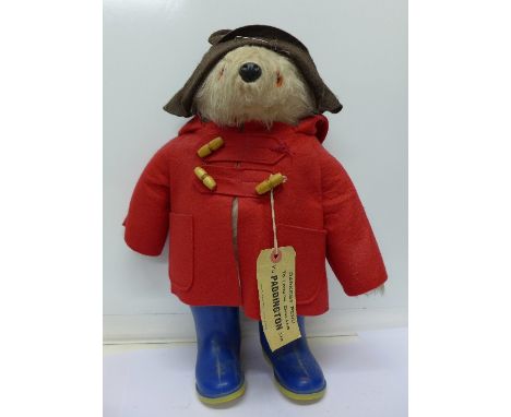 A Paddington Bear with blue Dunlop Wellington boots