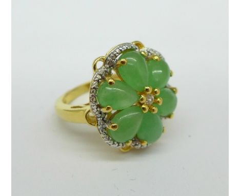 A silver gilt, topaz and green stone ring, M