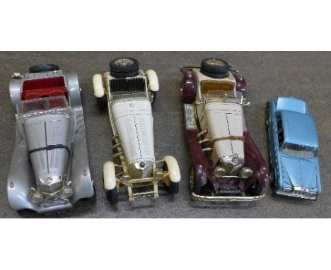 Four Burago model vehicles; three vintage and a Rolls Royce Silver Shadow