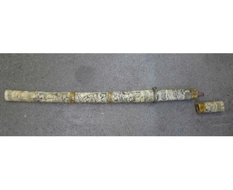 A carved Japanese sword with bone handle and scabbard, a/f