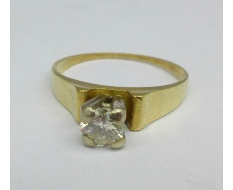 An 18ct gold and diamond solitaire ring, approximately 0.20 carat diamond weight, 3.5g, M