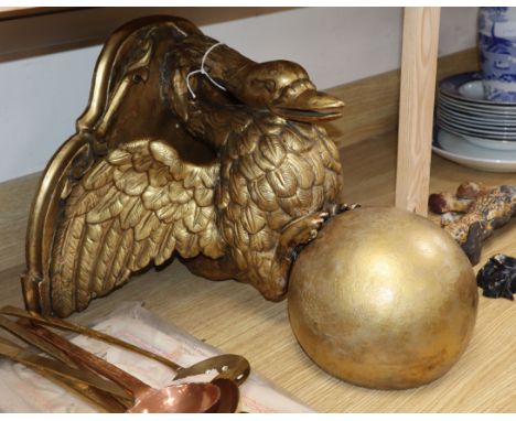 A gilt wall mounted console