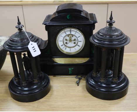 A Victorian black slate mantel clock and a pair of Portico side ornaments clock 31cm