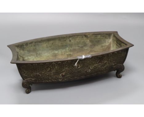 A Japanese Meiji bronze bonsai planter of shaped rectangular form cast with shells, on scrolled feet, signed to base, L 32cm