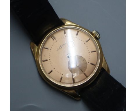 A gentleman's 18k yellow metal Lemania manual wind wristwatch with subsidiary seconds, on associated strap.