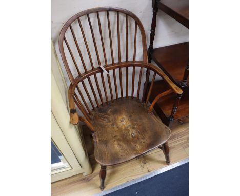 A Victorian yew and elm comb back Windsor armchair
