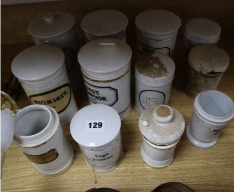 A collection of 19th century Continental ceramic chemist's jars, some with lids