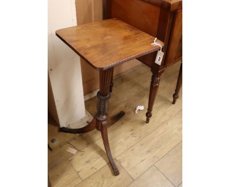 An early 19th century mahogany pedestal on carved fluted tapered column and tripod base (associated top) H.83cm