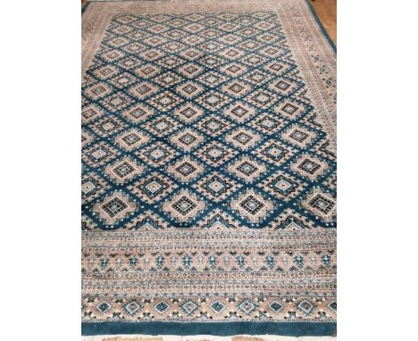 A teal ground Persian design carpet 366 x 270cm