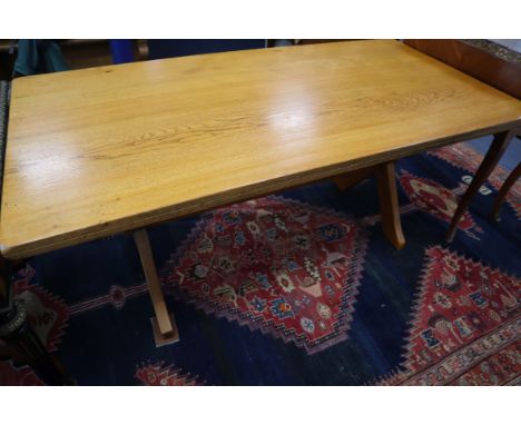 A light oak refectory style table on X-shaped end supports L.168cm