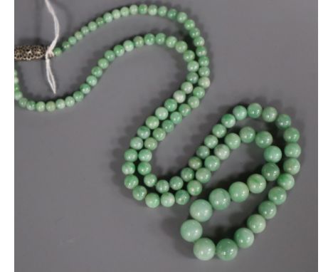 A single strand graduated jade bead necklace, with marcasite set sterling clasp, 68cm.