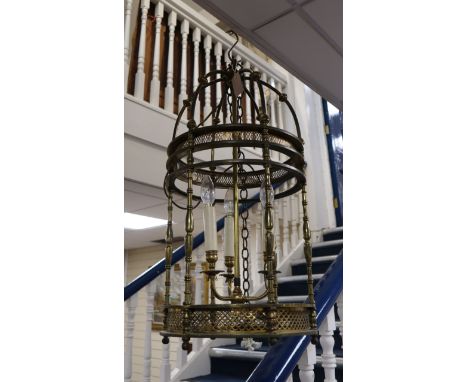 A brass hall lantern of cylindrical form fitted three candle lights, H approx 70cm Dia 37cm