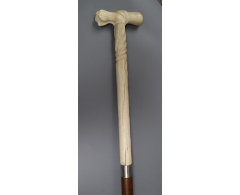 A Portuguese whalebone handled walking stick, the handle pre 1947 length 86cm