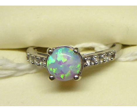 A 9ct. white gold Dress Ring with a centre opal and cubic zirconia. 