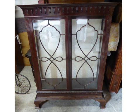 A Georgian design mahogany Display Cabinet enclosed by a pair of glazed tracery doors, on bracket feet, 3' 6" (107cms) wide.