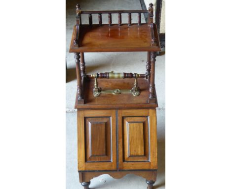 An Edwardian walnut Coal Box with patent self-opening mechanism beneath an open shelf with three quarter gallery and on short