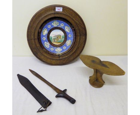 An African wooden Pillow, a Dagger with leather scabbard, and Persian enamel Dish, 9" (23cms) diameter in wooden frame.