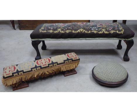 An oblong Stool with upholstered top, on claw and ball feet; a circular Footstool and one other Stool.