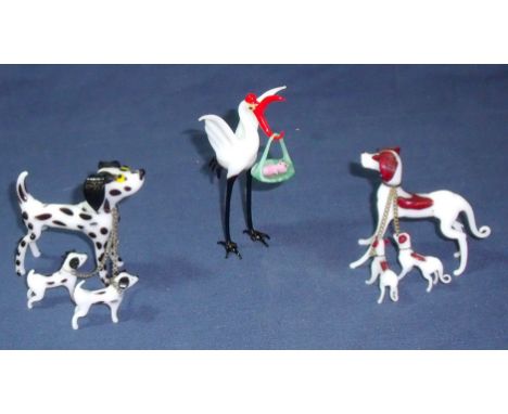 Two glass lamp work dogs and puppies and a lamp work glass stork (stork missing two toes)