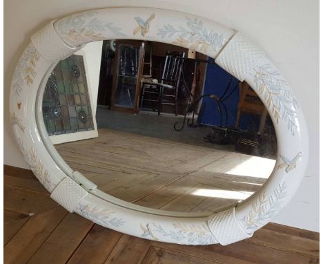 Large oval mirror the ceramic border with painted bird and leaf decoration (size 86cm x 54cm)