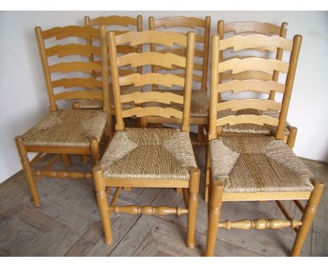 Set of six light oak 'Unicorn Man' ladder back dining chairs with rush seats with turned supports 