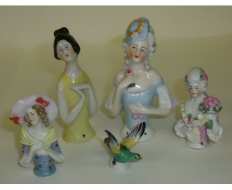 Four Staffordshire pin cushion ladies and small ceramic bird