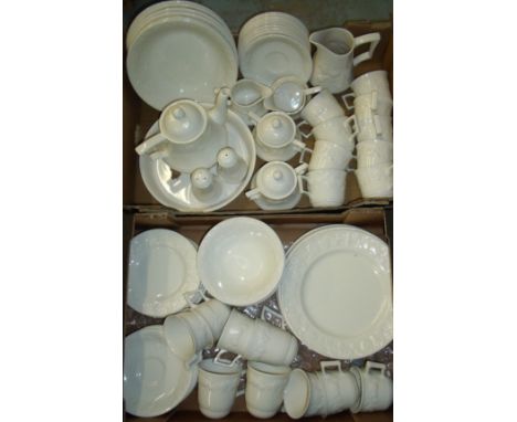 Large selection of white glazed table ware with moulded fruit decoration comprising cups, saucers, bowls, teapot, sugar bowls