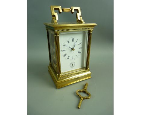 A QUALITY SWISS BRASS CASED CARRIAGE CLOCK for Matthew Norman Retailers, London, the classically styled case with reeded colu