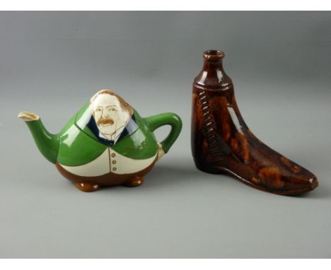 A FOLEY INTARSIO TEAPOT and a treacle glazed boot flask, the Wileman & Co statesman form teapot depicting David Lloyd George,