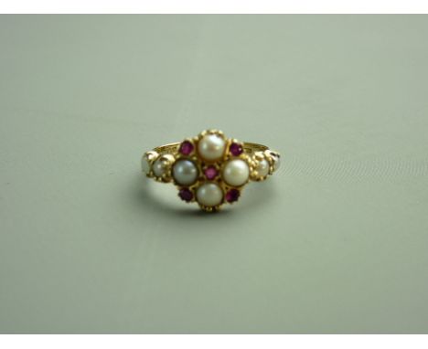 A FOURTEEN CARAT GOLD PEARL (six) & RUBY (five) DRESS RING, 3.2 grms 