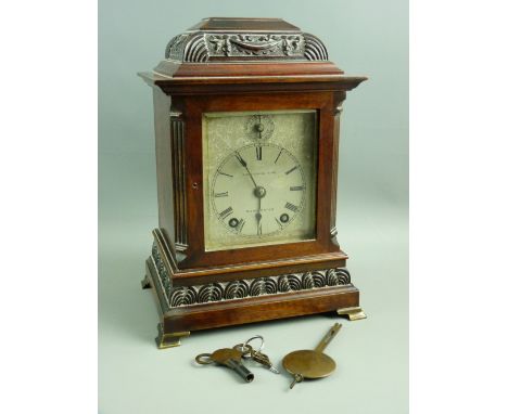 A WINTERHALDER & HOFMEIER EIGHT DAY MANTEL CLOCK, the caddy top architectural case with ribbon swag carving and reeded canted