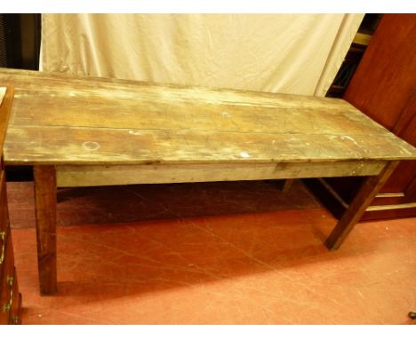 A VINTAGE RECTANGULAR PINE FARMHOUSE TABLE having a three plank top and bolt-on corner square supports, 76 cms high, 211 cms 