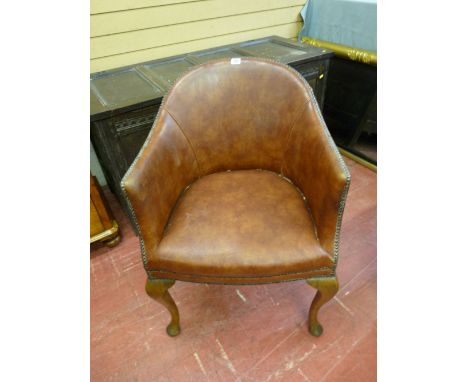 A VINTAGE OAK & LEATHER ARMCHAIR with steel button edging having a brass presentation plaque at the rear to 'R P Hickman, 30t