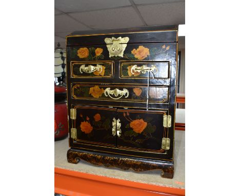 A MODERN ORIENTAL STYLE CABINET, decorated with  transfer print peach coloured roses, a gilt metal butterfly clasp to secure 