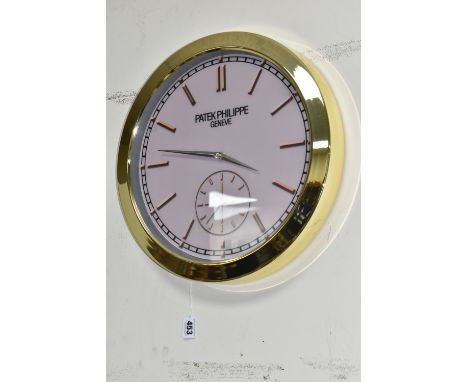 A DISPLAY WALL CLOCK, dial printed 'Patek Philippe, Geneve', with faux subsidiary dial and marked with numeral markers, batte